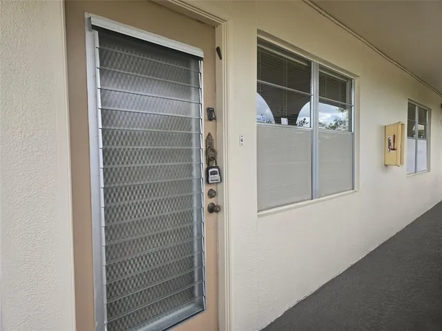 a kitchen with a refrigerator and a stove top oven