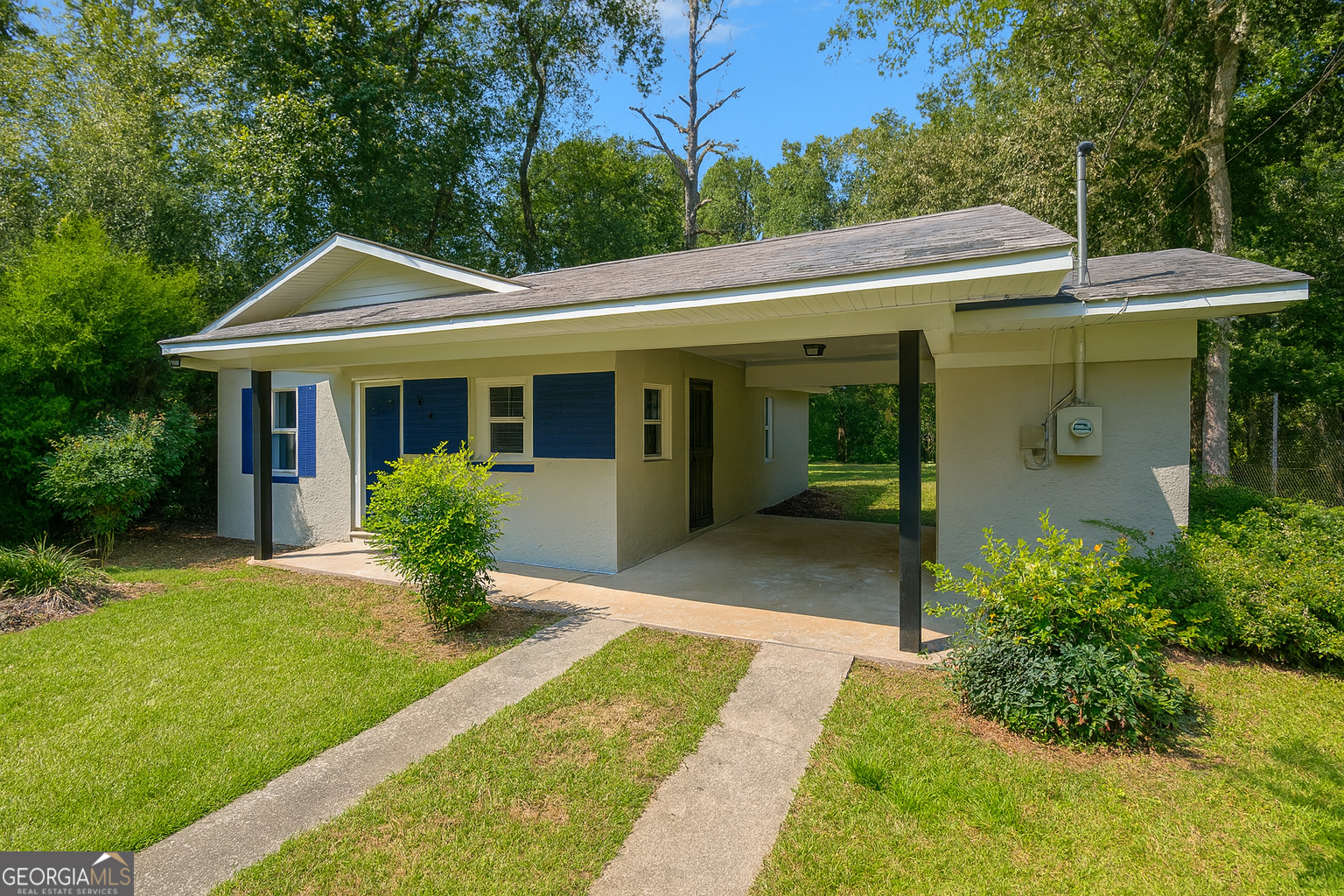 402 Johns Road Warner Robins, GA 31093 - Photo 2 of 8 a view of house with a yard