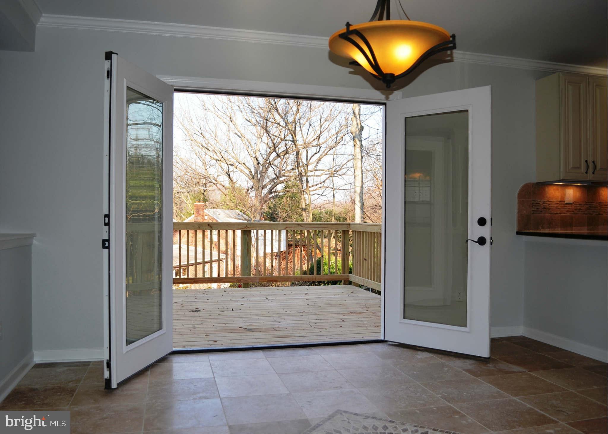9931 Woodburn Road Silver Spring, MD 20901 - Photo 7 of 27 French Doors in Kitchen leading to Deck
