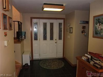 178 Wichita Place Akron, OH 44313 - Photo 2 of 16 A large foyer with ceramic floors is a great gathering space for welcoming guests.