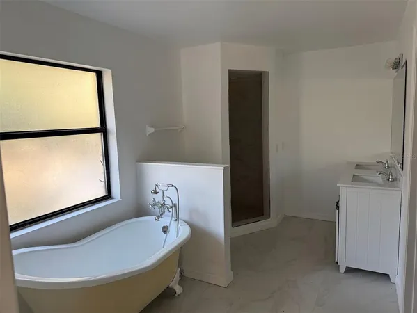 a bathroom with a sink and a window