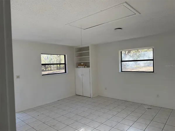 an empty room with windows