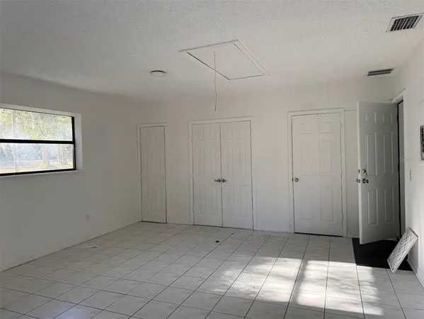 a view of a closet area with entryway