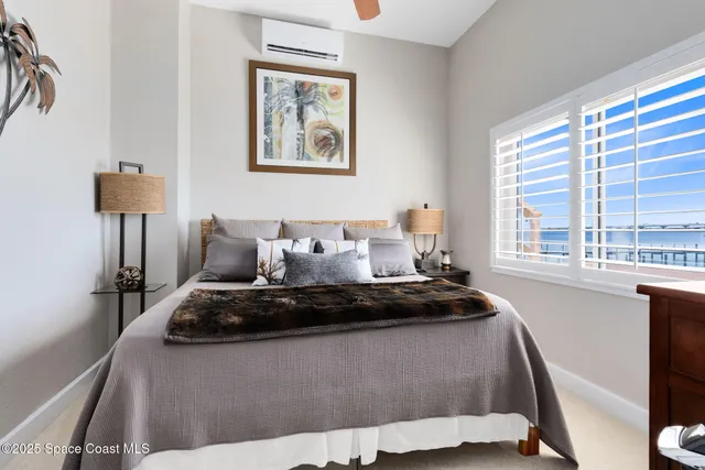 a bedroom with bed and window