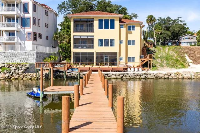 a view of a lake with building and outdoor space