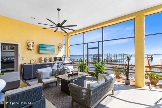 a living room with furniture a rug and a window