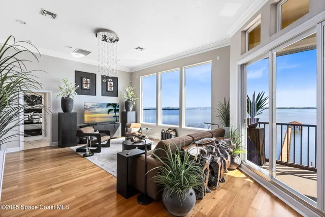 a living room with furniture fireplace and a flat screen tv