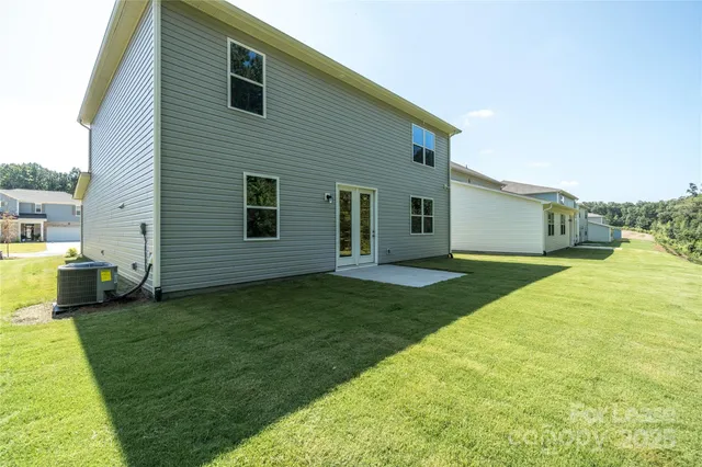 a view of a house with backyard porch and garden