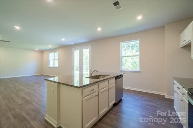 a kitchen with sink and window