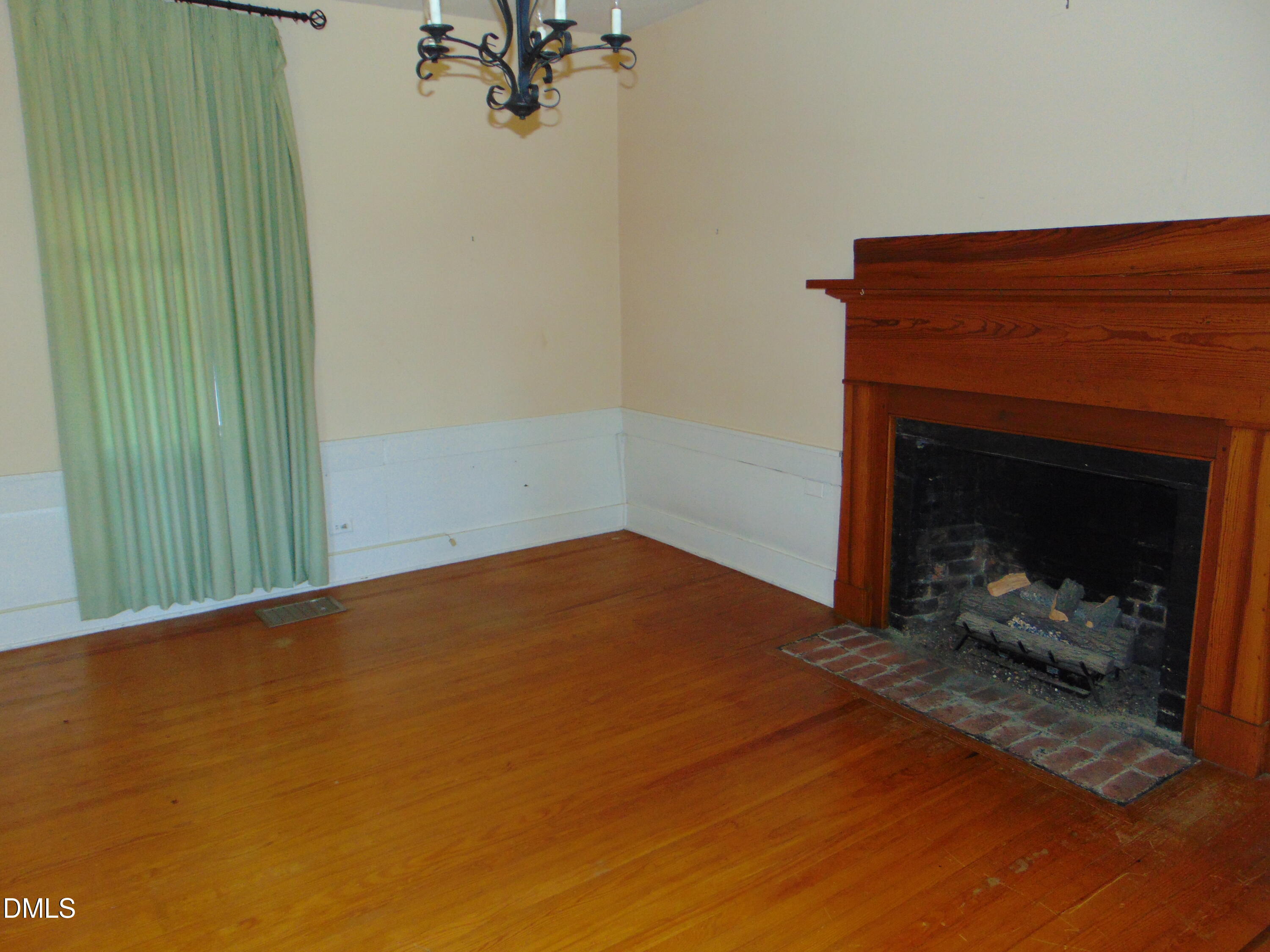 4067 Chewning Road Oxford, NC 27565 - Photo 67 of 82 a view of empty room with a fireplace