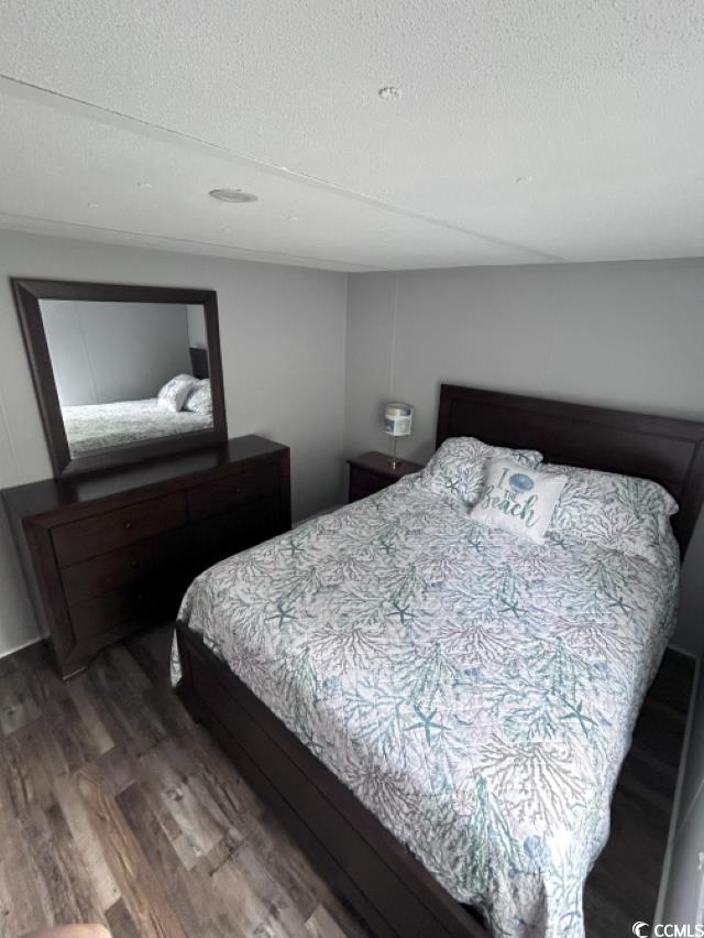 356 Calhoun Drive Murrells Inlet, SC 29576 - Photo 12 of 26 Bedroom with a textured ceiling and wood finished