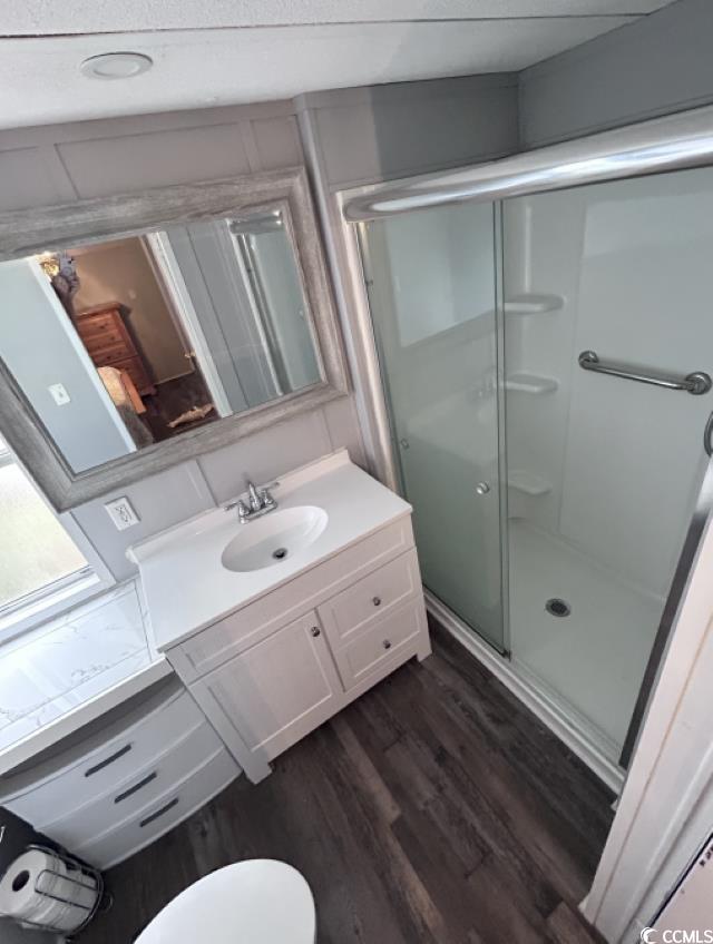 356 Calhoun Drive Murrells Inlet, SC 29576 - Photo 8 of 26 Full bathroom with vanity, a shower stall, and woo
