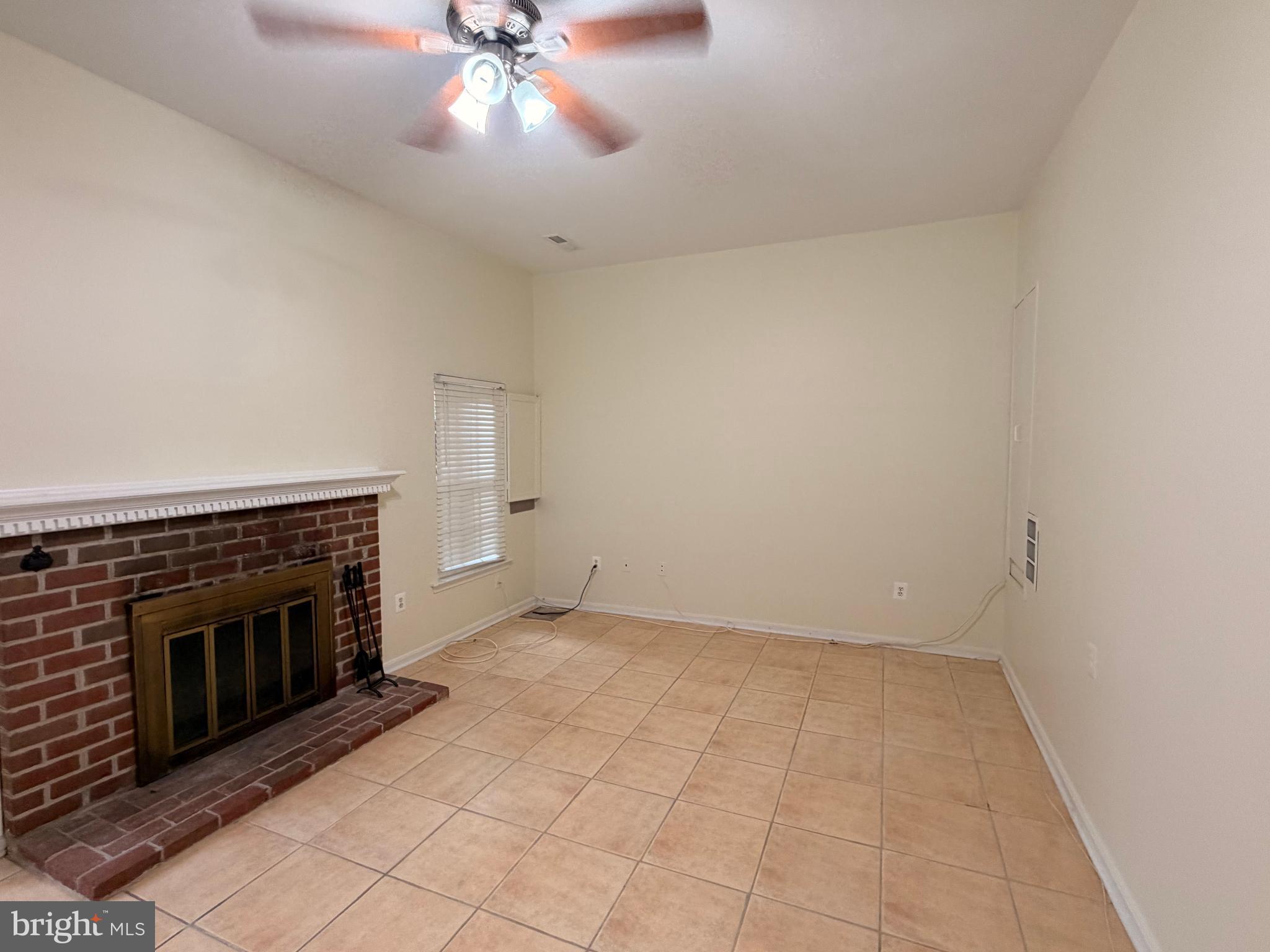 8818 Ridge Hollow Court Springfield, VA 22152 - Photo 16 of 32 an empty room with windows and fireplace