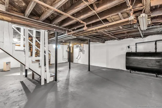 a view of an empty room with stairs