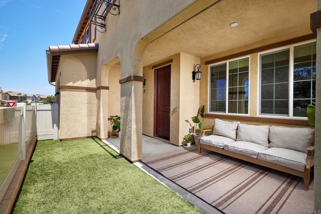 a view of a porch with furniture