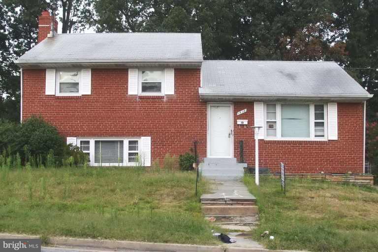 1418 Ray Road Hyattsville, MD 20782 - Photo 1 of 1 a front view of a house with a yard