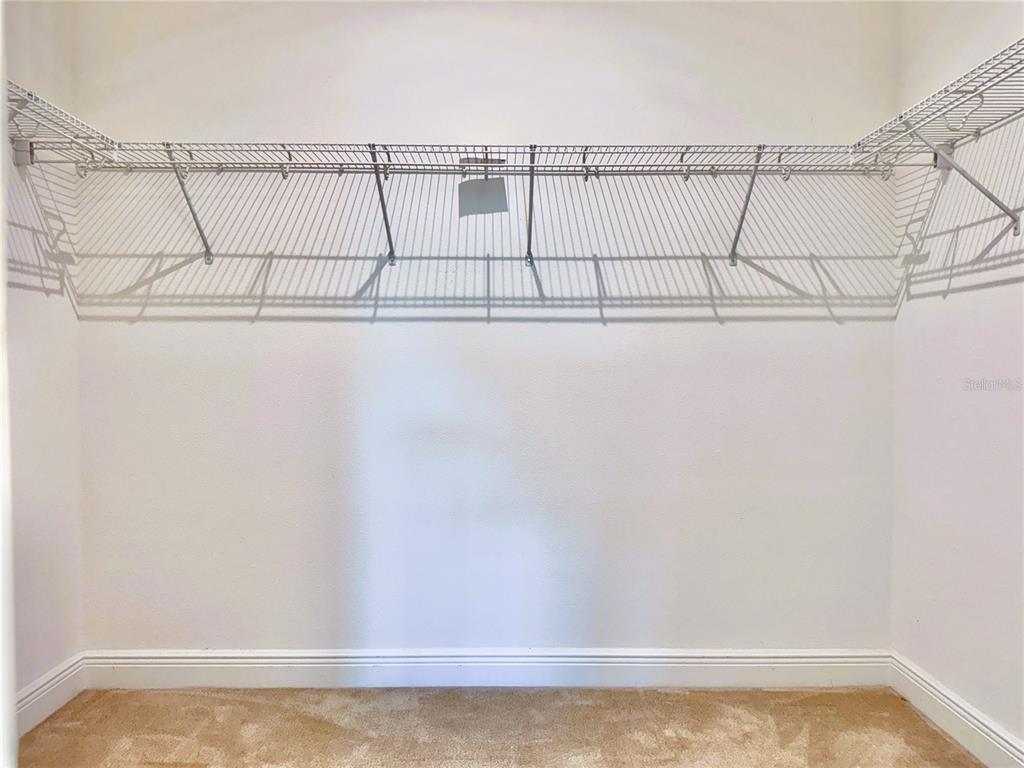 12941 Westside Village Loop Windermere, FL 34786 - Photo 29 of 47 a view of a room with racks on the wall