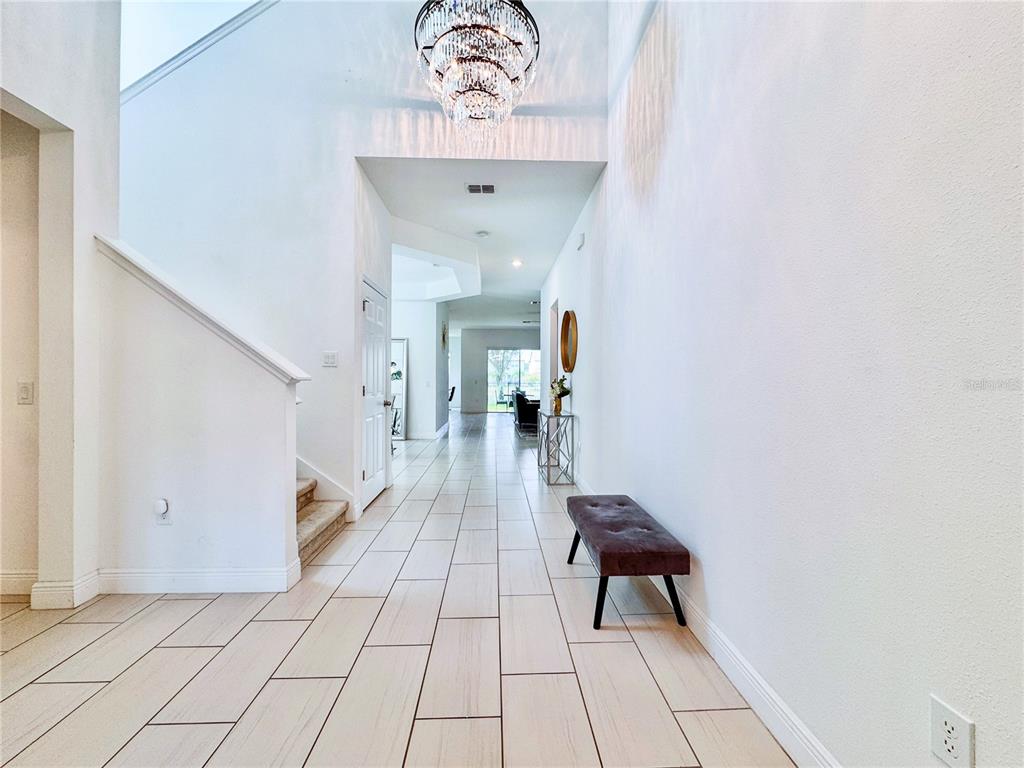 12941 Westside Village Loop Windermere, FL 34786 - Photo 4 of 47 a view of a hallway with entryway