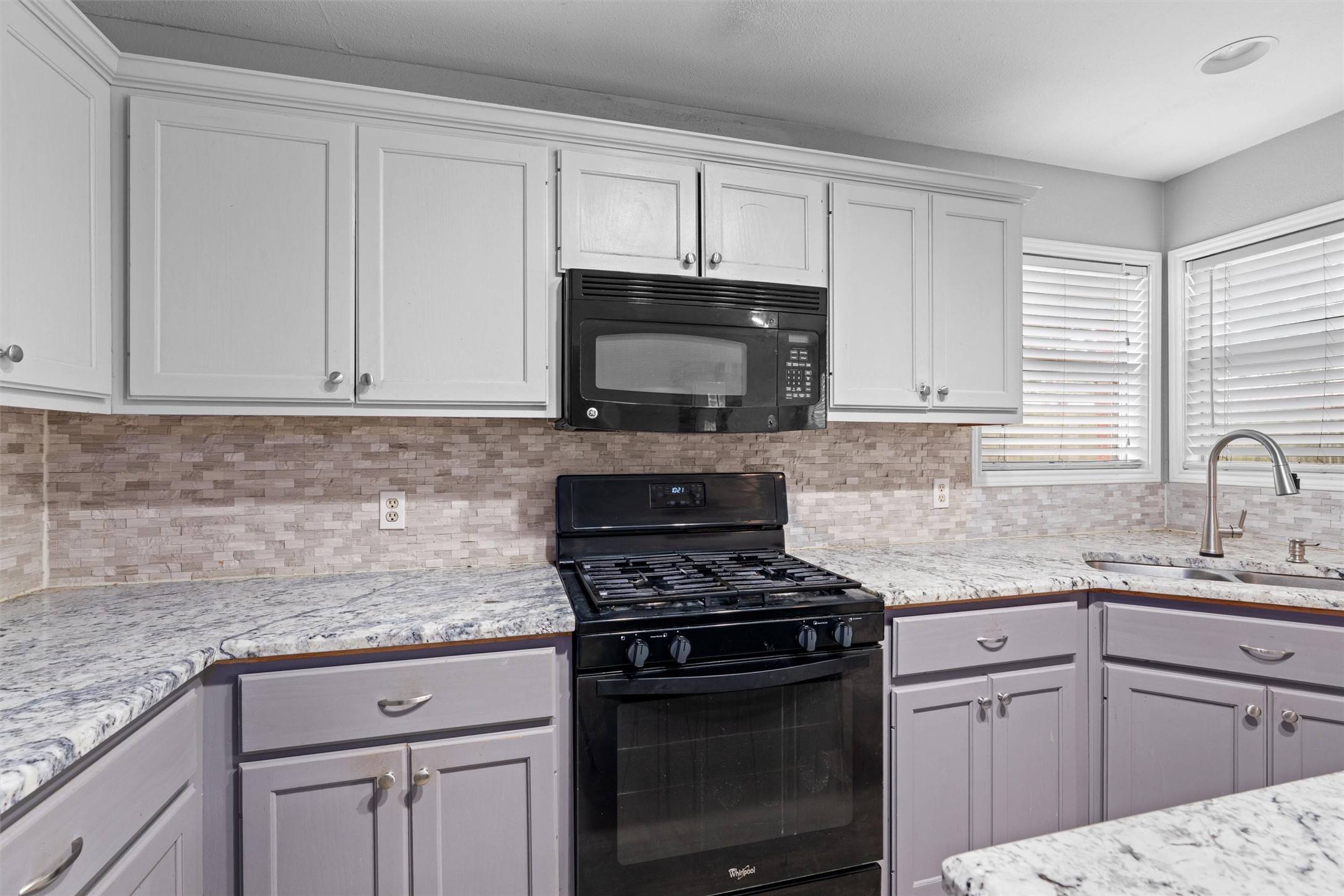 2306 Raintree Path Round Rock, TX 78664 - Photo 10 of 23 An inviting kitchen features granite counters, contemporary appliances, and ample cabinet space.