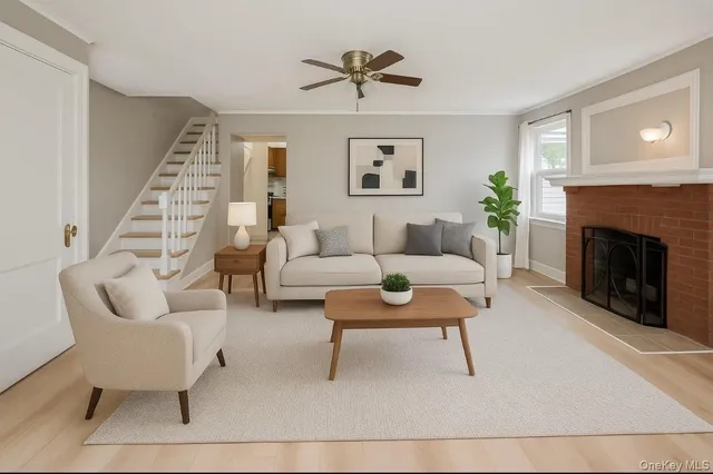 a living room with furniture and a fireplace