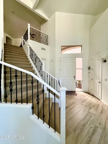 a view of entryway with wooden floor