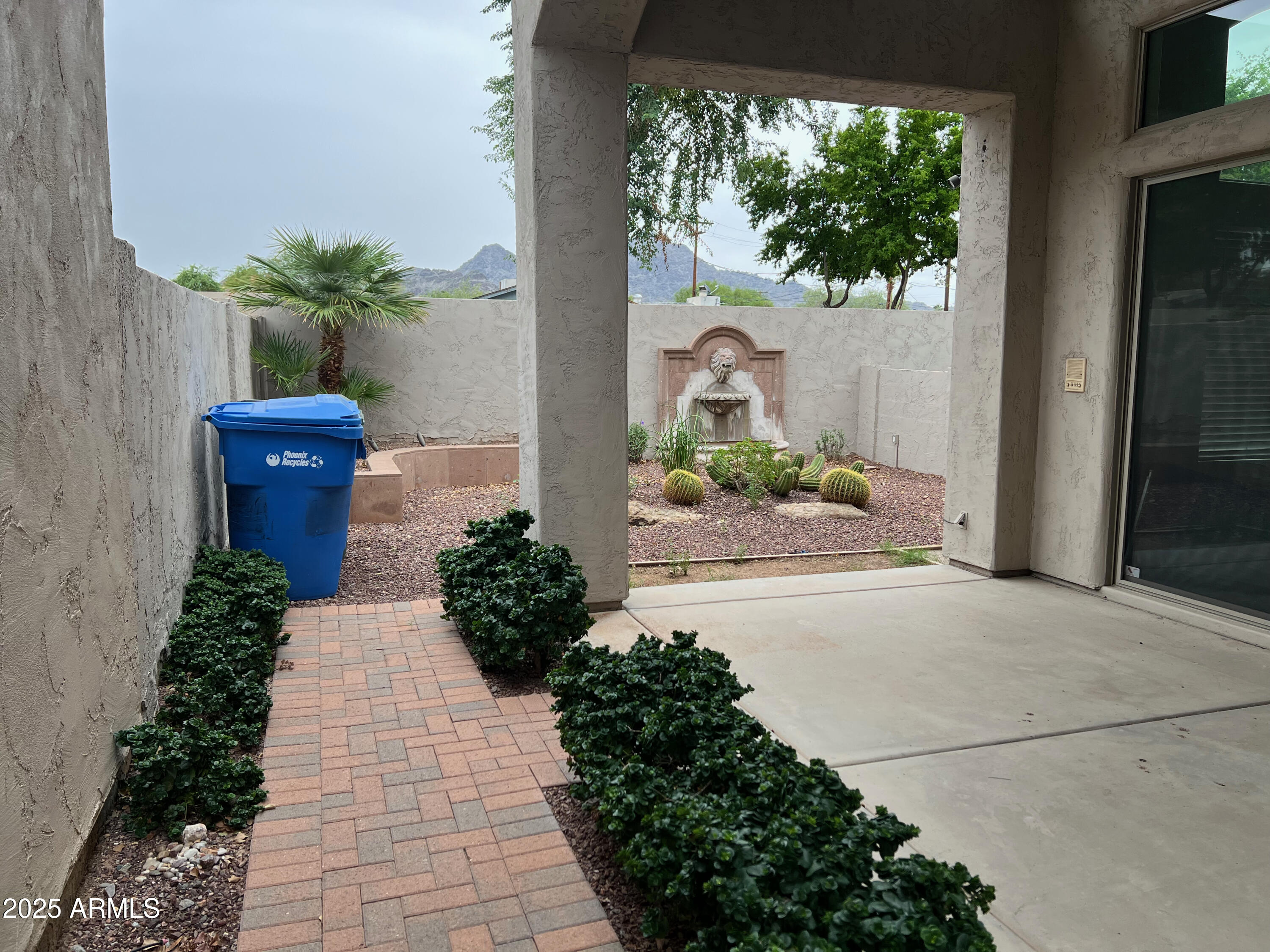 8131 North 13th Way Phoenix, AZ 85020 - Photo 18 of 25 a view of a garden with a fountain