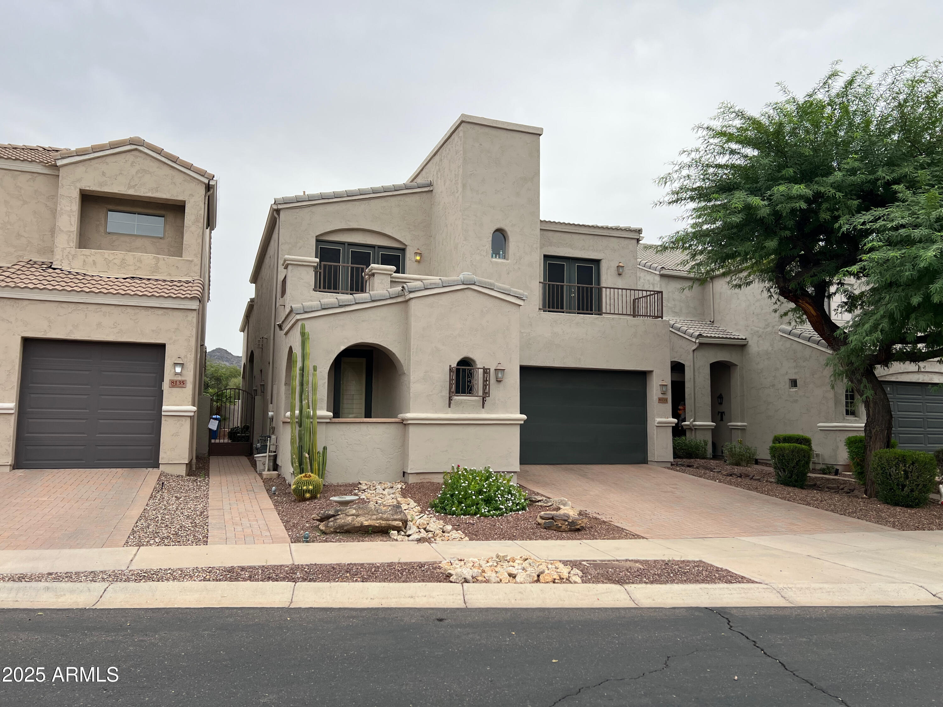 8131 North 13th Way Phoenix, AZ 85020 - Photo 2 of 25 a front view of a house with a yard