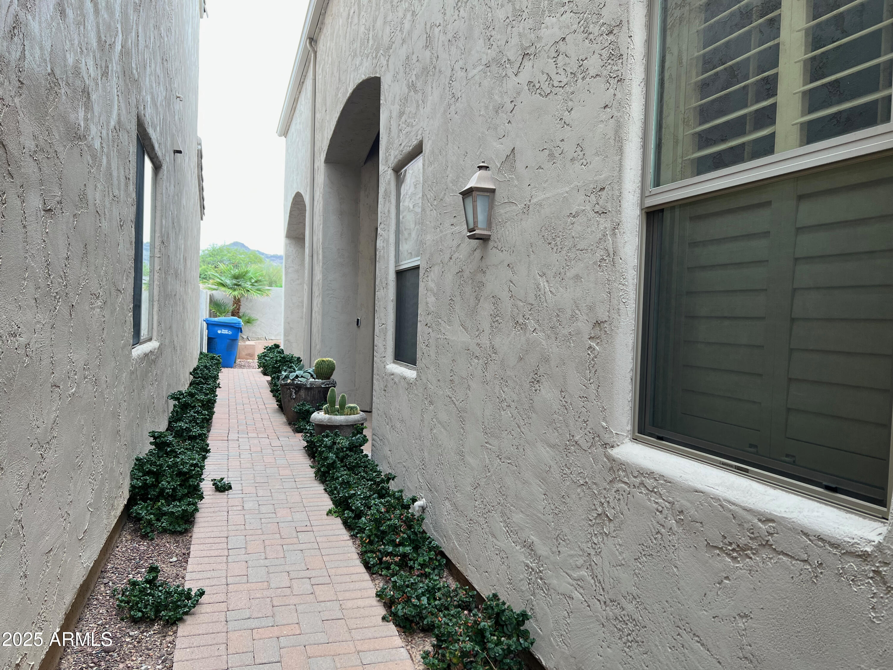 8131 North 13th Way Phoenix, AZ 85020 - Photo 3 of 25 a view of a pathway besides a building