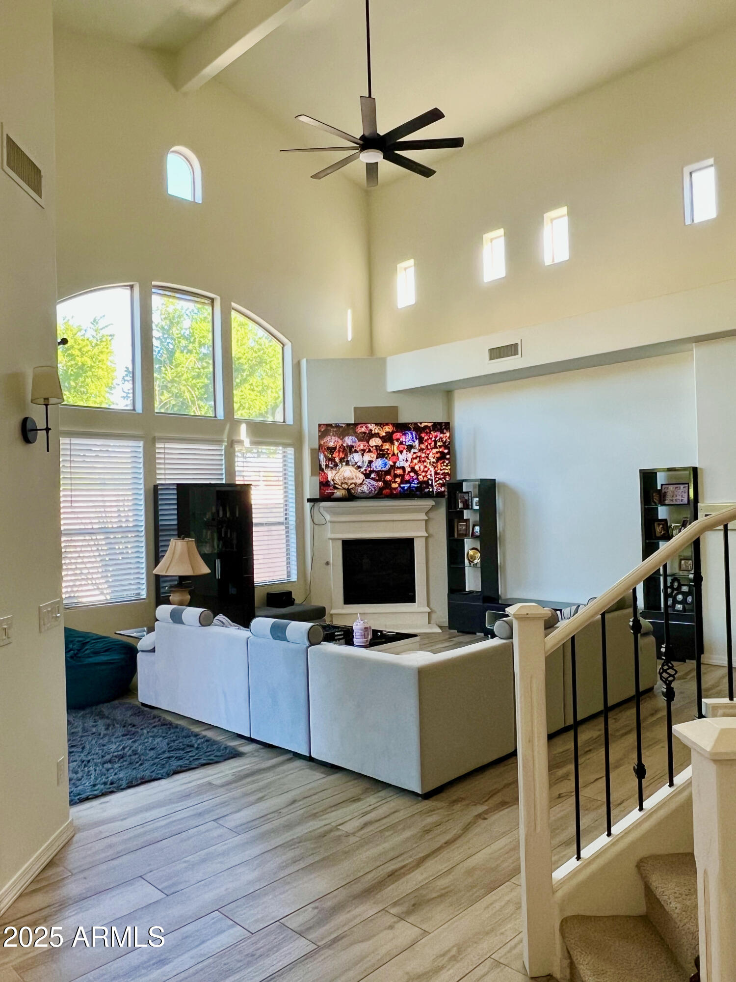 8131 North 13th Way Phoenix, AZ 85020 - Photo 5 of 25 a living room with furniture and a flat screen tv