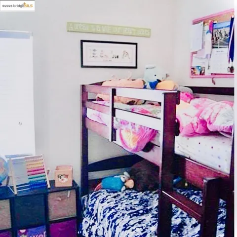 a bedroom with a bed and cabinets