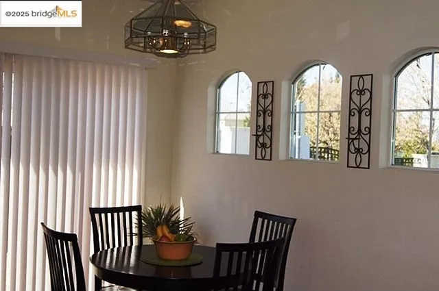 a view of a livingroom with furniture and windows