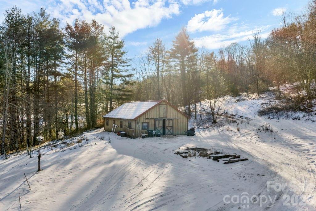 3606 Highway 194 Sugar Grove, NC 28679 - Photo 14 of 48 a backyard of a house with lots of green space and outdoor seating