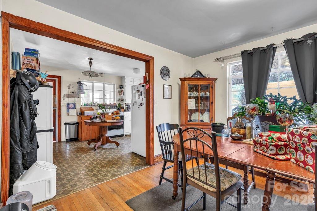 3606 Highway 194 Sugar Grove, NC 28679 - Photo 40 of 48 a living room with furniture a window and a dining table with wooden floor