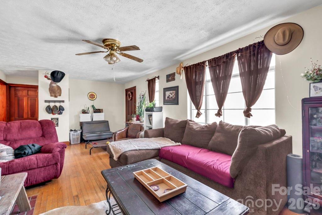 3606 Highway 194 Sugar Grove, NC 28679 - Photo 41 of 48 a living room with furniture a large window and a chandelier