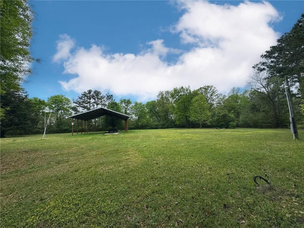 280 Owens Road Fort Mitchell, AL 36856 - Photo 35 of 56 View of green lawn with a carport