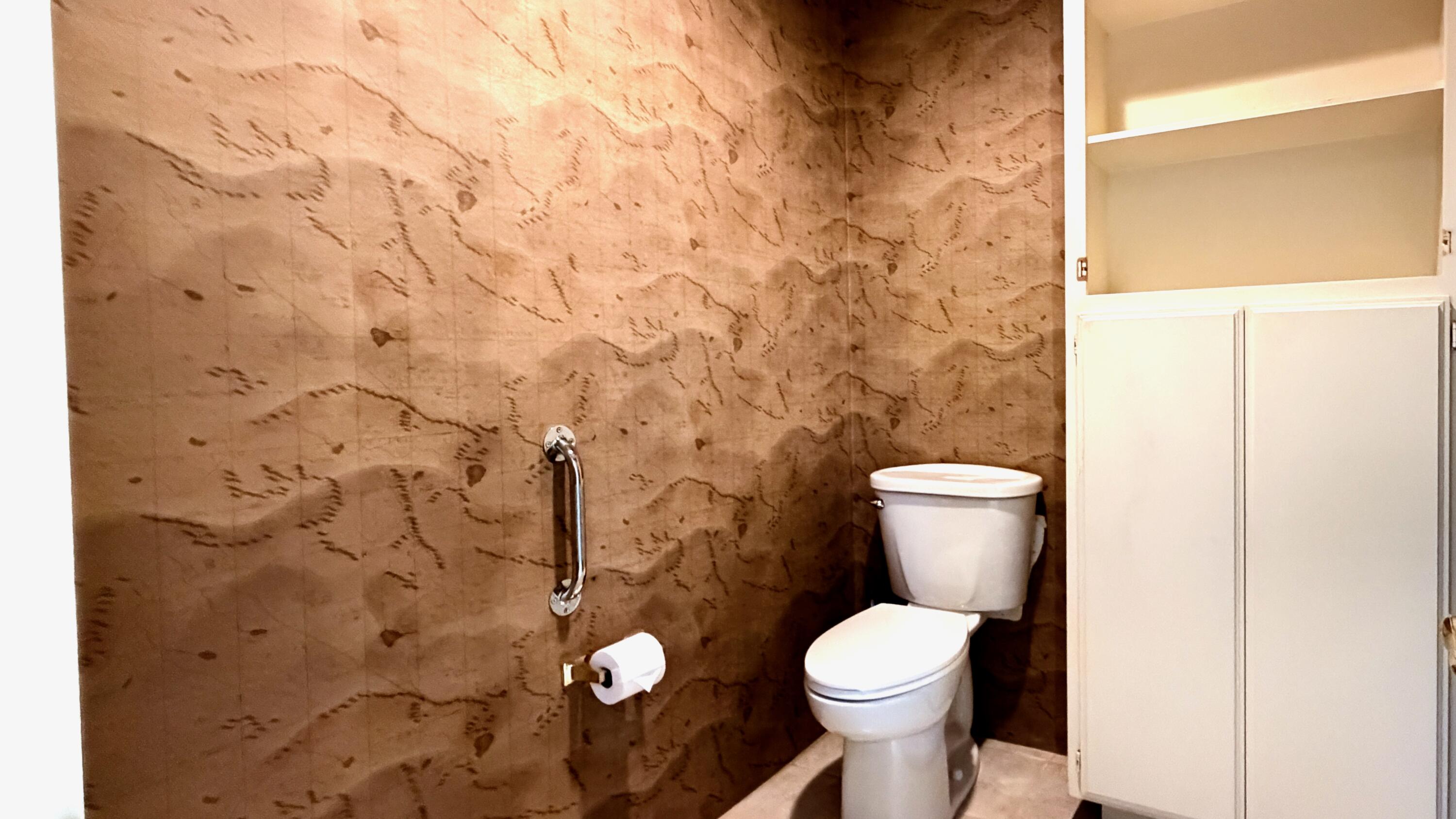 59 Oak Tree Drive Rancho Mirage, CA 92270 - Photo 13 of 22 a white toilet sitting next to a shower curtain