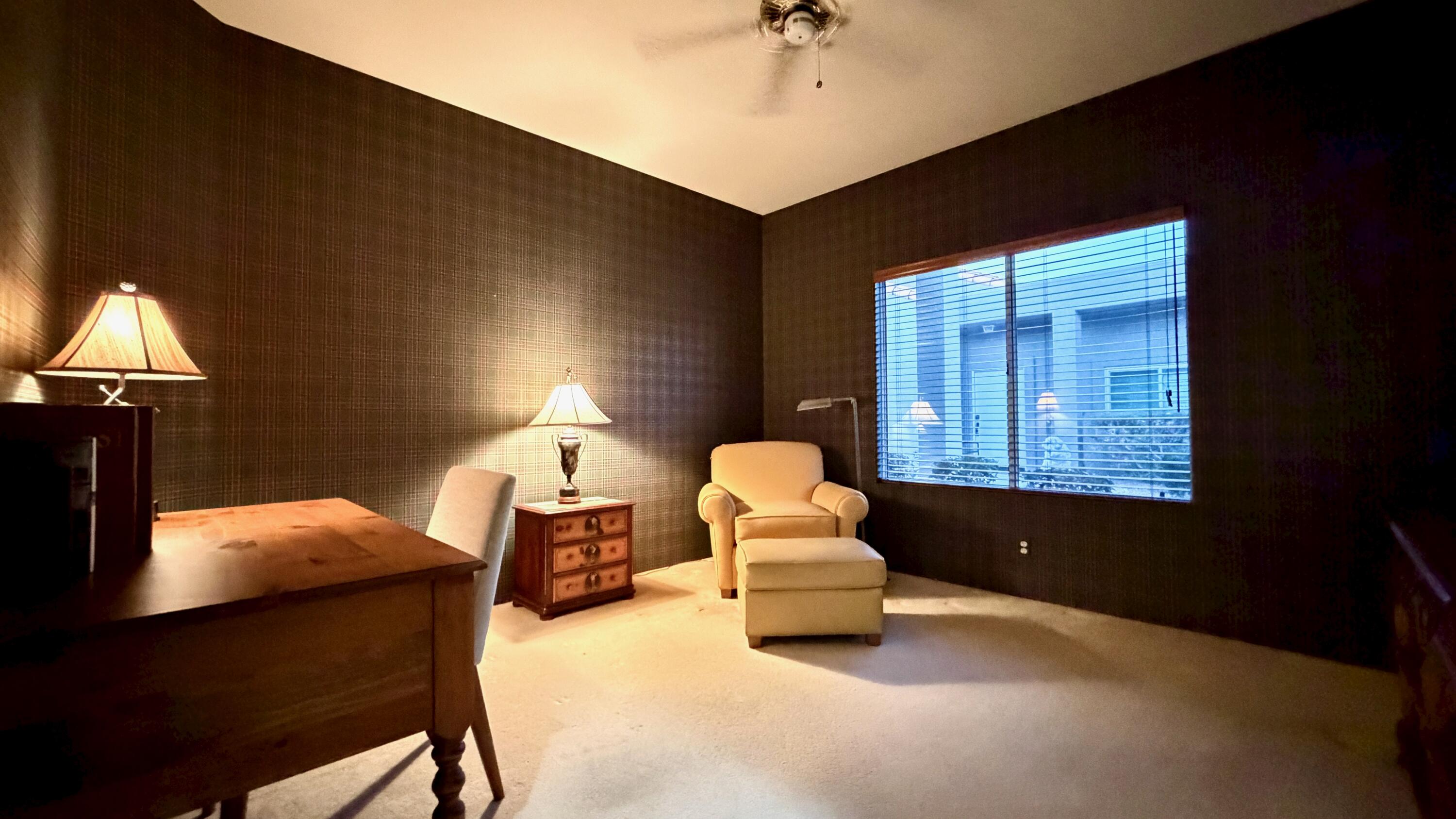 59 Oak Tree Drive Rancho Mirage, CA 92270 - Photo 14 of 22 a living room with furniture and a chandelier