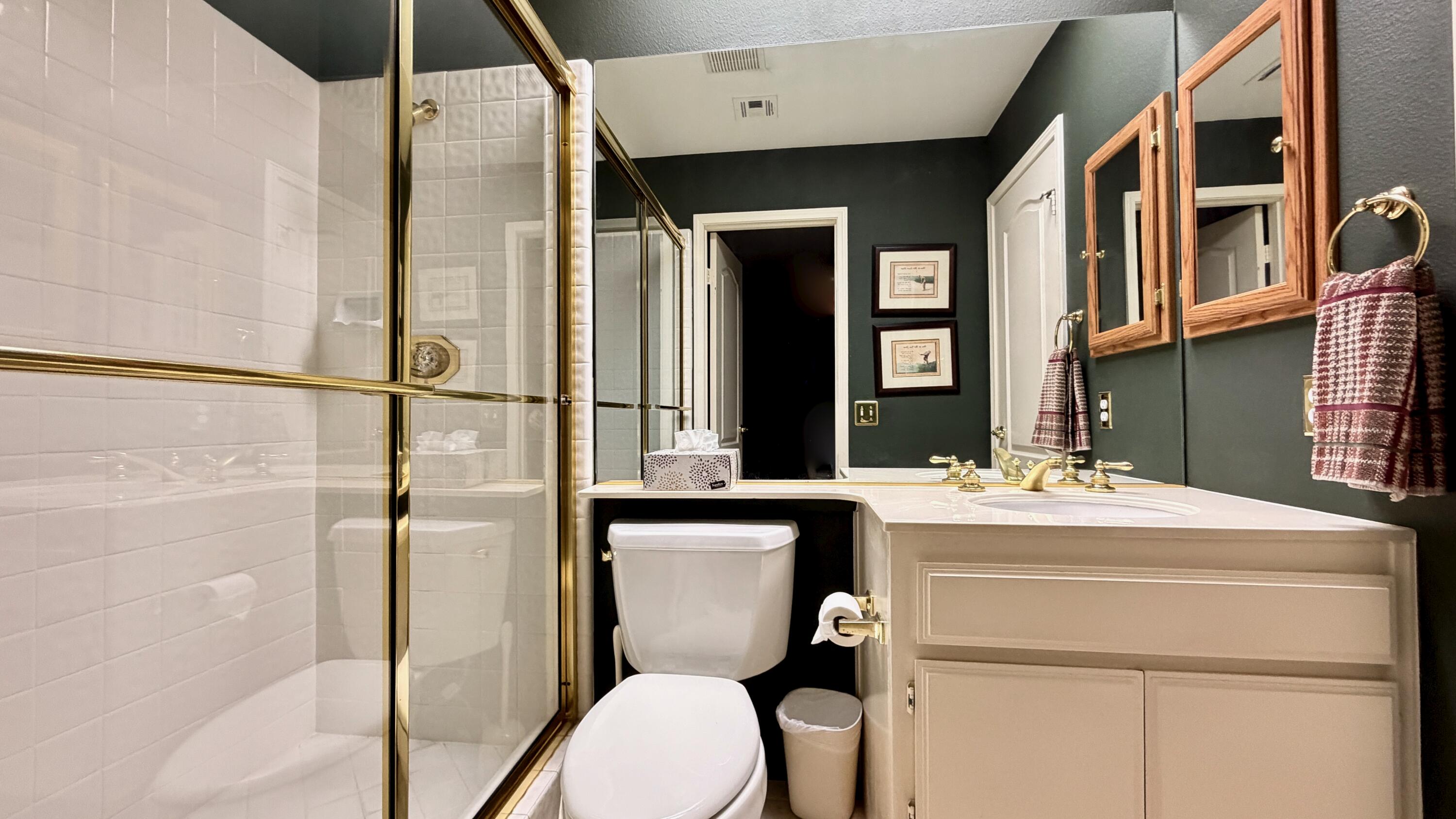 59 Oak Tree Drive Rancho Mirage, CA 92270 - Photo 15 of 22 a bathroom with a toilet sink and shower