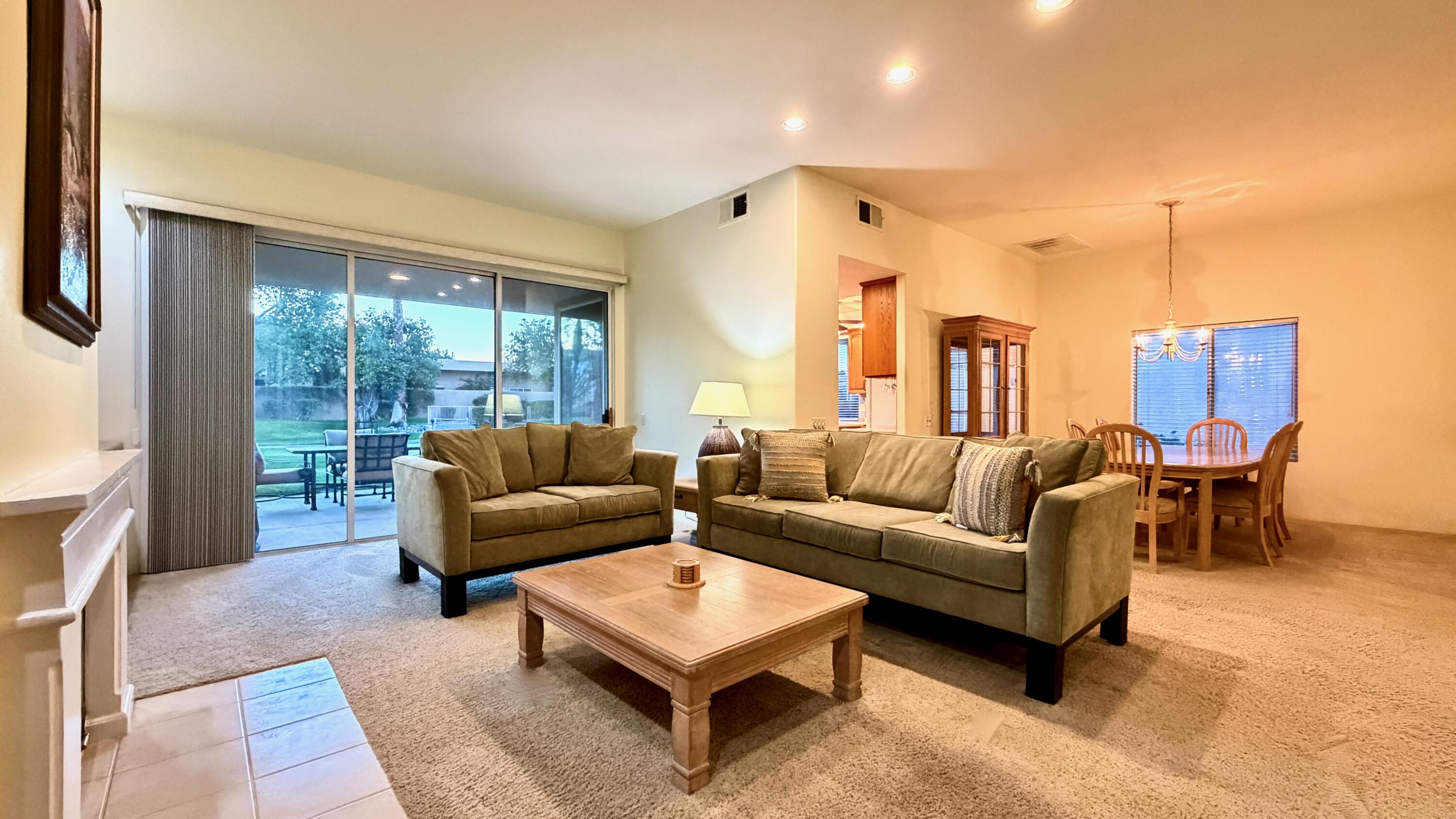 59 Oak Tree Drive Rancho Mirage, CA 92270 - Photo 9 of 22 a living room with furniture and a large window