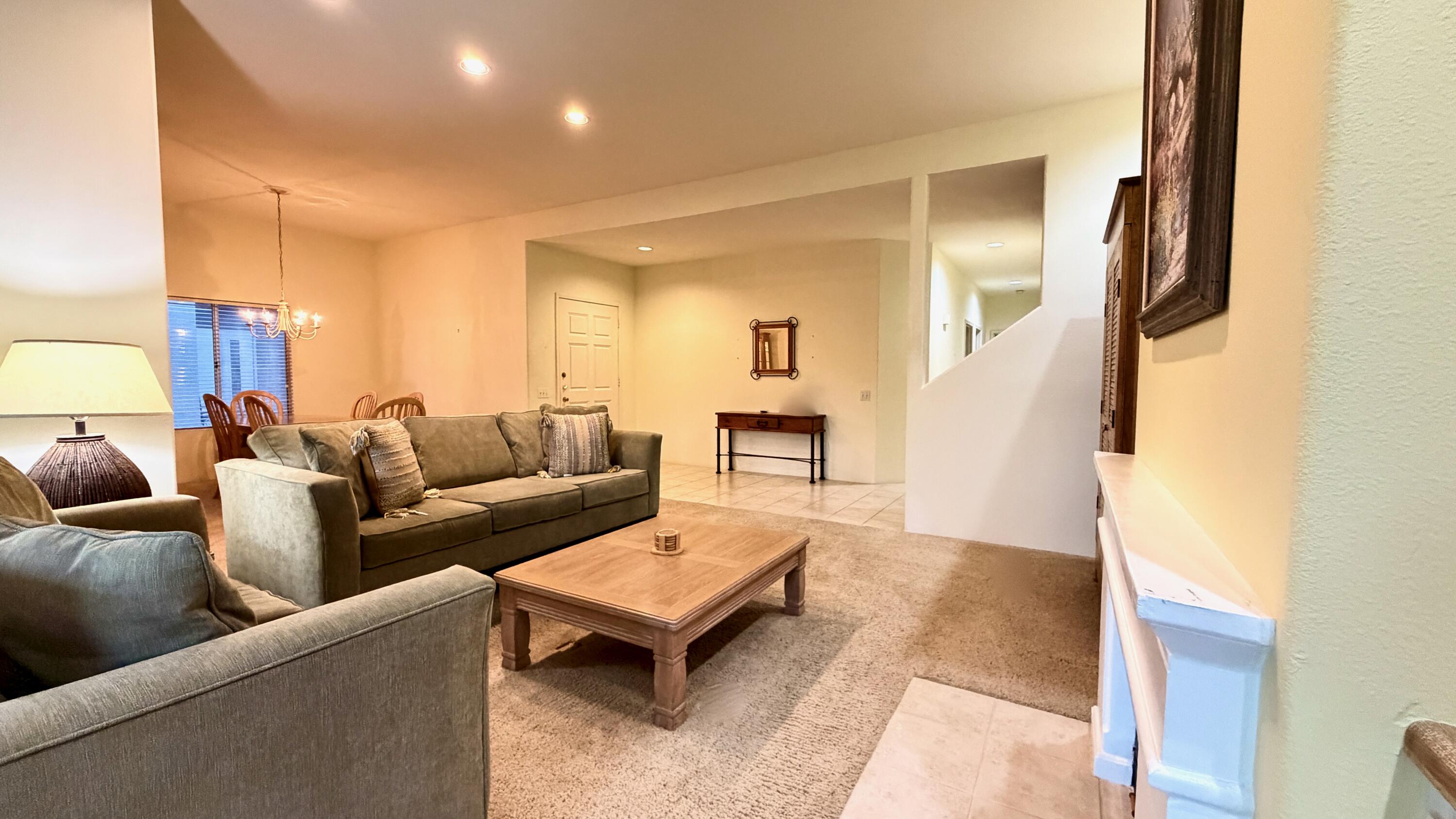 59 Oak Tree Drive Rancho Mirage, CA 92270 - Photo 10 of 22 a living room with furniture and a wooden floor