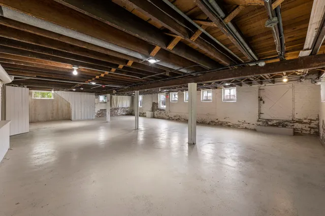 a view of a room with wooden floors