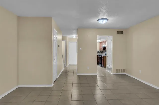 an empty room with staircase