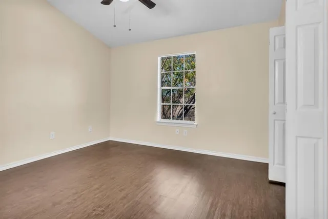 an empty room with a wooden door