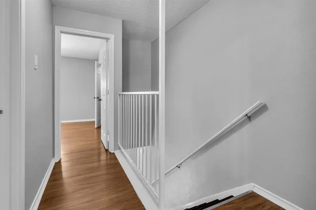 a view of cabinets with wooden floor