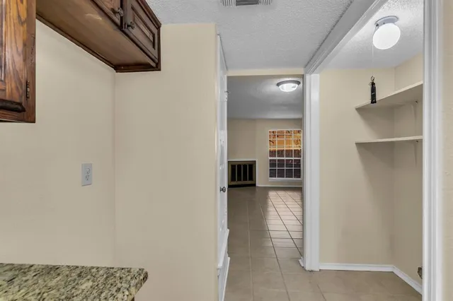 a view of hallway with wooden floor