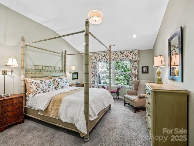 a bedroom with a bed window and couch