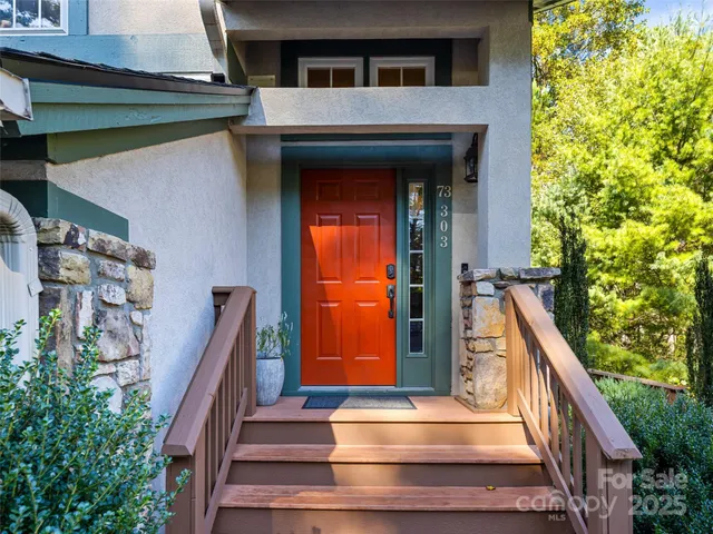 a view of front door and small plants