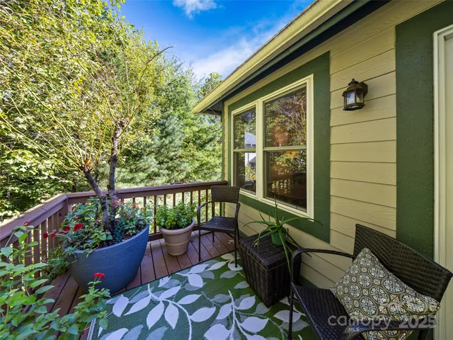 a view of balcony with furniture