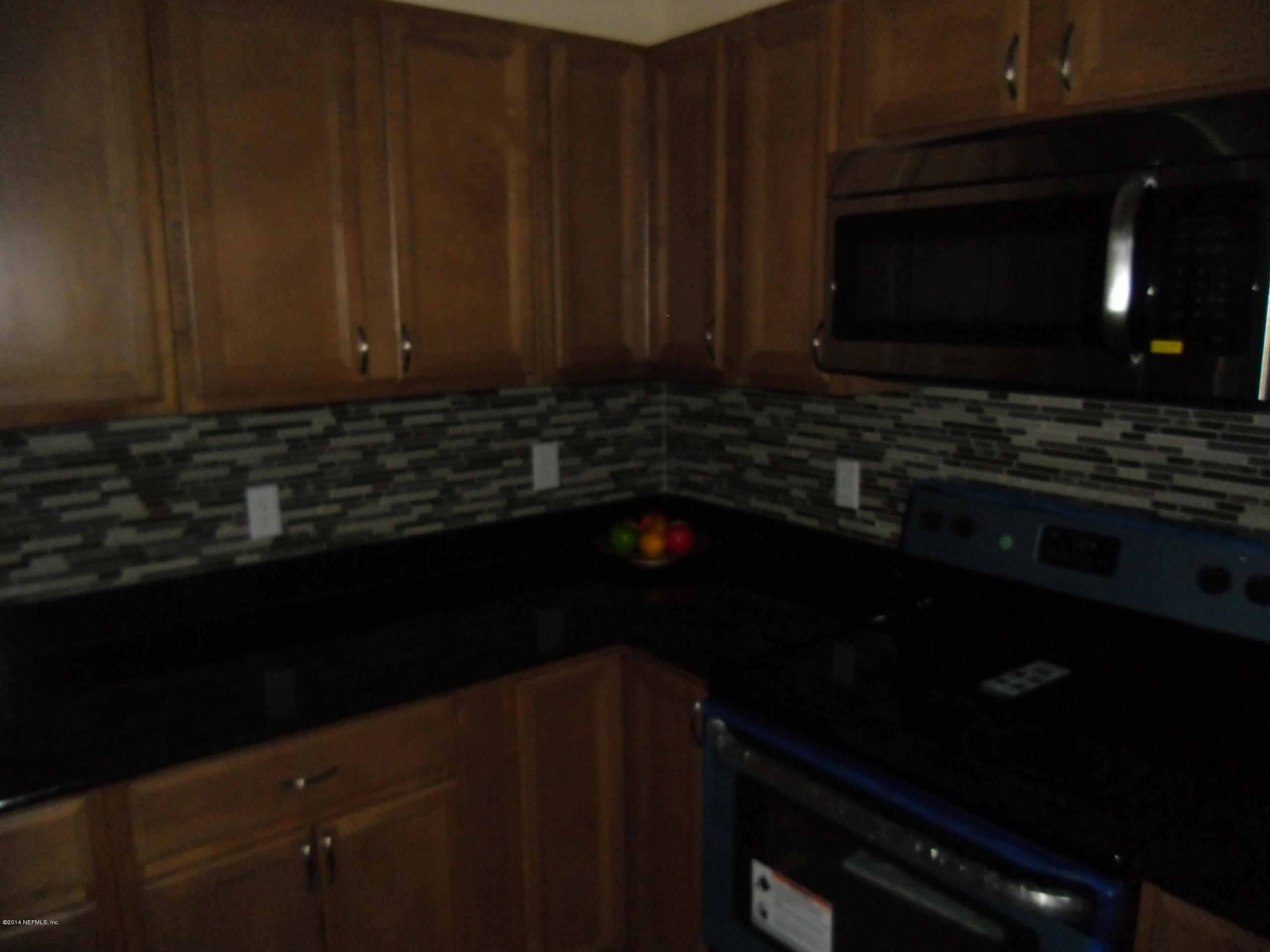 4221 Spring Park Road Jacksonville, FL 32207 - Photo 11 of 56 a kitchen with a sink