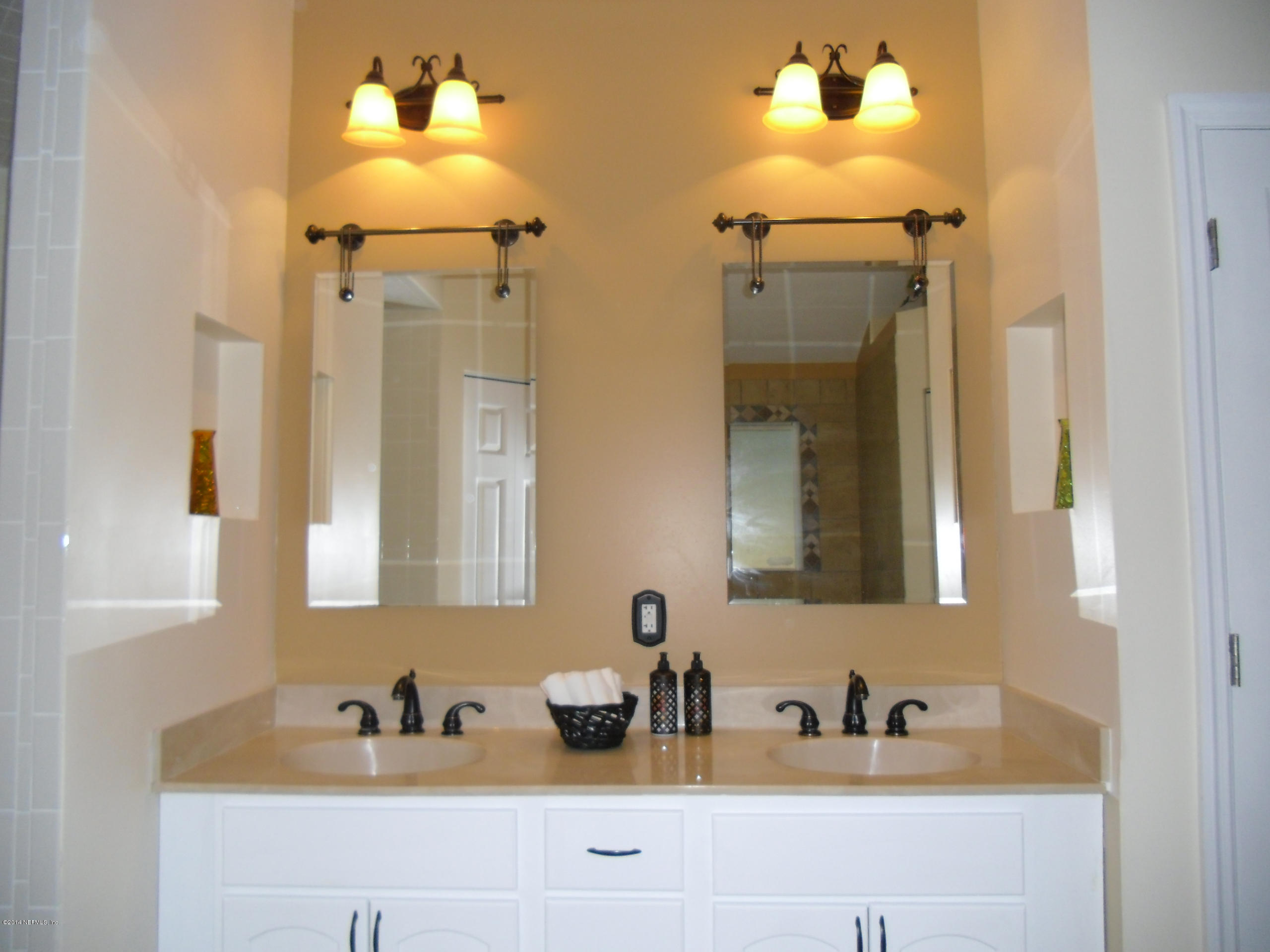 4221 Spring Park Road Jacksonville, FL 32207 - Photo 22 of 56 a bathroom with a sink and a mirror